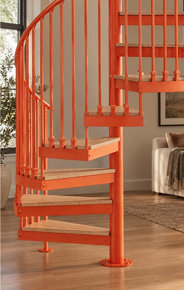 Orange spiral staircase with wood treads in a residential interior