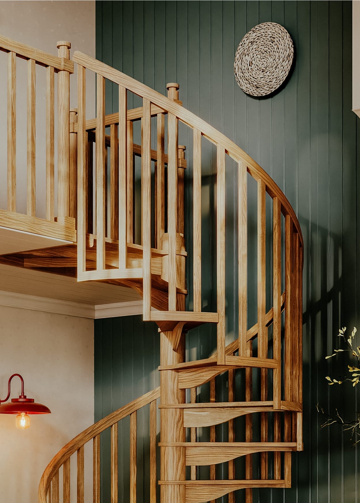 Carpenter spiral staircase with oak spindles and handrail curving down from the loft landing