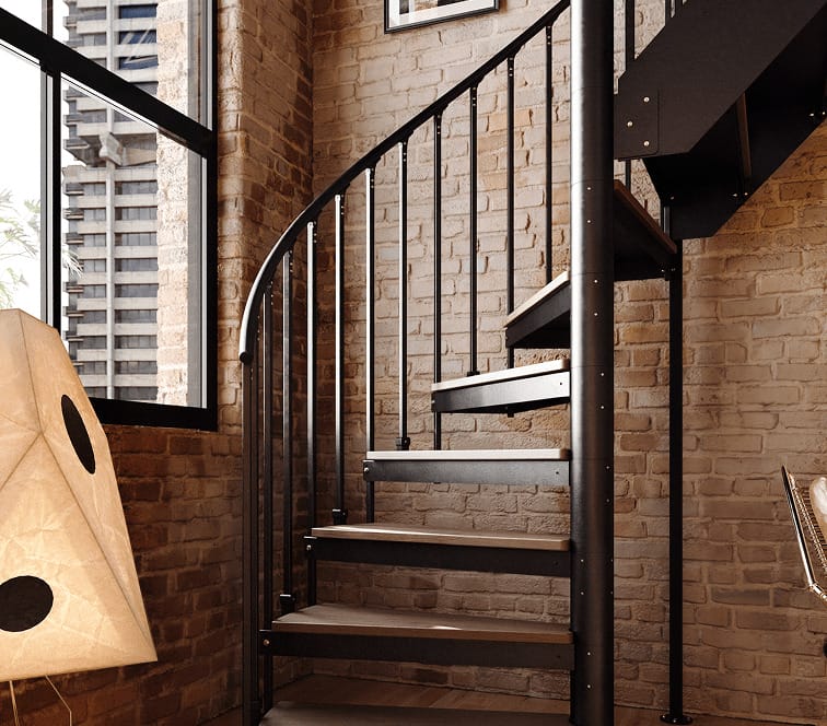 Combination staircase with black metal spindles and wood-tone treads in a brick-walled loft