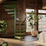 Multi-Line spiral staircase in a green painted finish inside a rustic wood-paneled loft