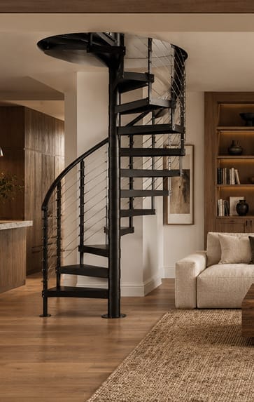 Multi-Line spiral staircase in a black finish with complete multi-line rod railing system in an open living space