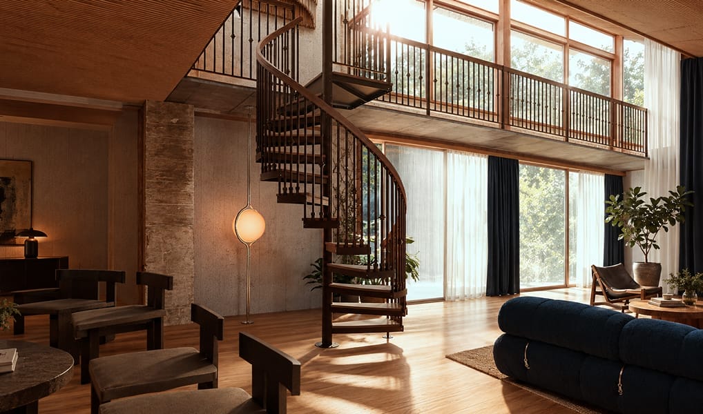 Bronze metal spiral staircase with wood treads and handrail connecting two floors of a modern living room with floor-to-ceiling windows