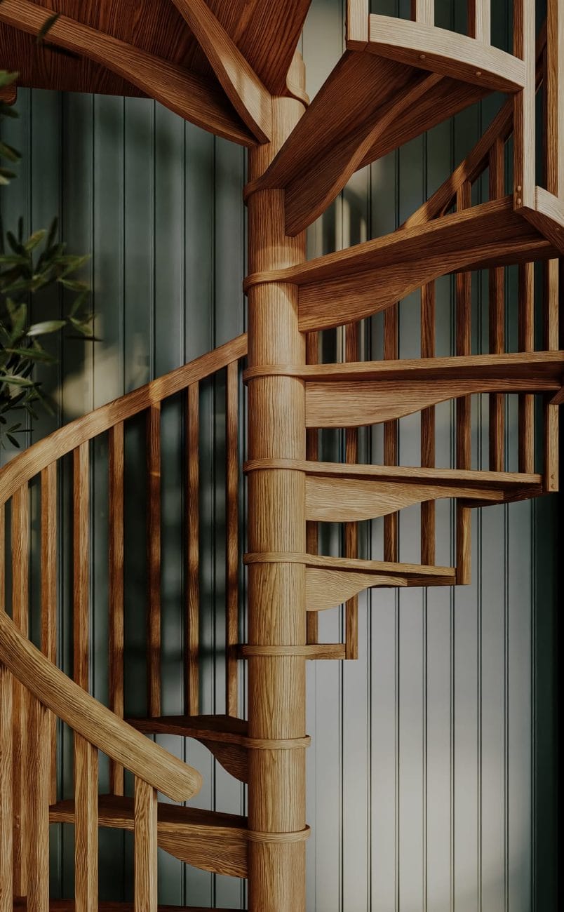 Close-up of a Carpenter Spiral Series staircase with oak treads, spindles, and center pole against a green paneled wall