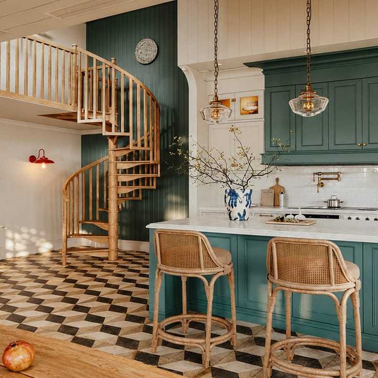 Carpenter Spiral series staircase leading to a loft above a kitchen with green cabinetry, checkered tile floor, and a marble island