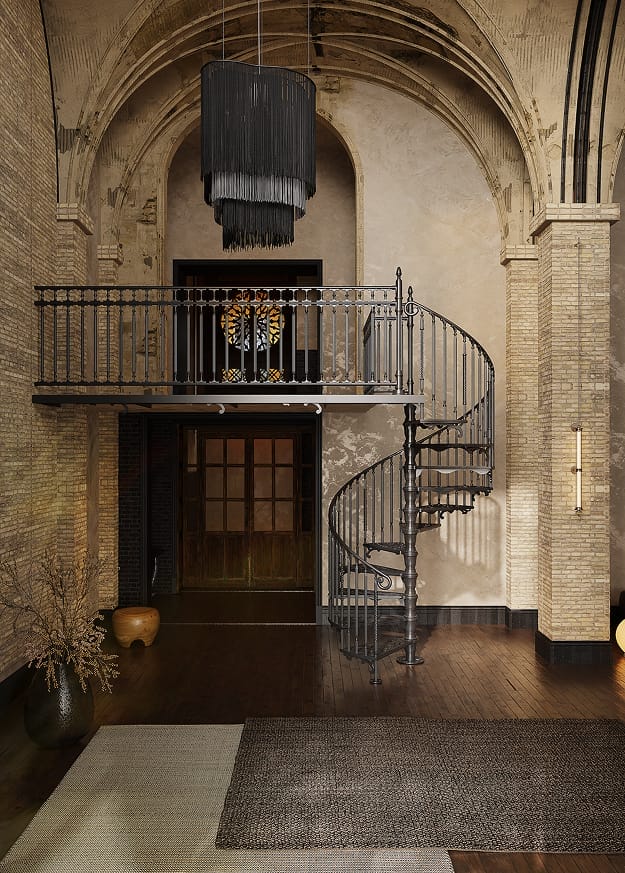 Victorian spiral staircase with a balcony landing in a vaulted interior